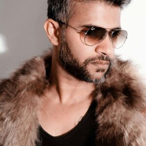 Fashion-forward man wearing a fur coat and sunglasses, exuding style.